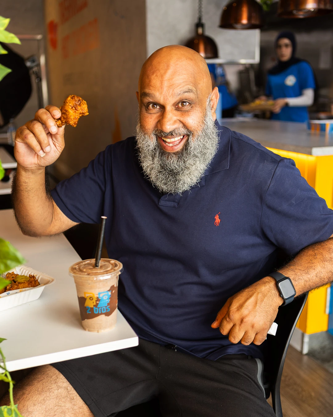 Founder eating chicken